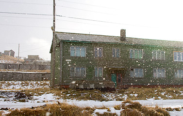 Image showing Wooden cottage covered with snow