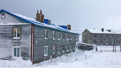 Image showing Wooden cottage covered with snow