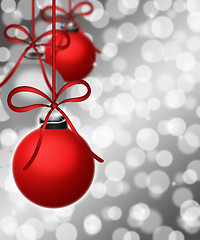 Image showing Hanging Ornaments on Blurred Silver Background