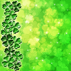 Image showing Lucky Four Leaf Clover Shamrock on Blurred Background