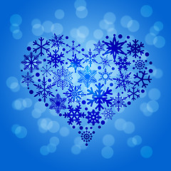 Image showing Christmas Snowflakes Heart Shape on Blurred Background