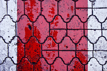 Image showing Background of red crosswalk on road paved by tiles