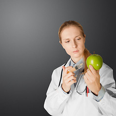 Image showing scientist woman with apple