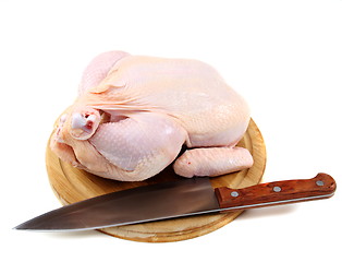 Image showing Uncooked chicken on a cutting board.