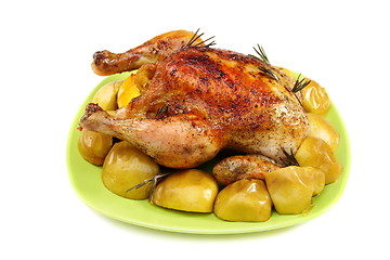 Image showing Chicken stuffed with lemons, apples and rosemary.
