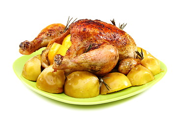 Image showing Chicken stuffed with lemons, apples and rosemary.