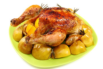 Image showing Chicken stuffed with lemons, apples and rosemary.