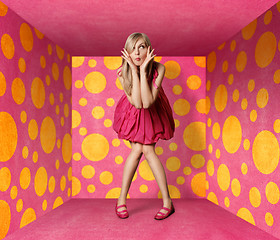 Image showing surprised blonde in pink dress