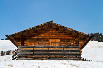 Image showing Old winter cottage with fence