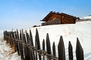 Image showing Old winter cottage with fence