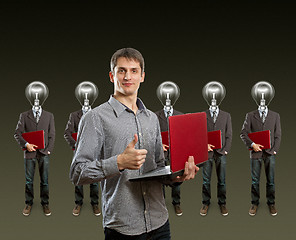 Image showing lamp head businesspeople with laptop