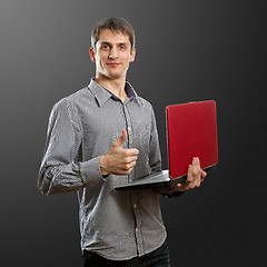 Image showing male with laptop in his hands well done