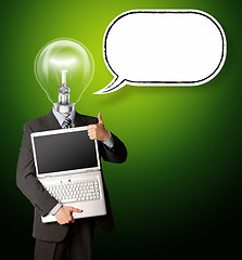 Image showing businessman with lamp-head with open laptop and bubble