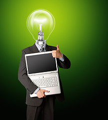 Image showing businessman with lamp-head with open laptop shows welldone