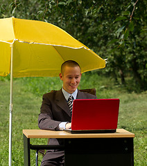 Image showing businessman with umbrella