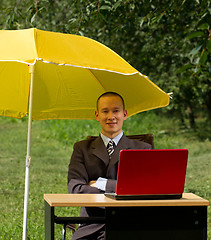 Image showing businessman with umbrella