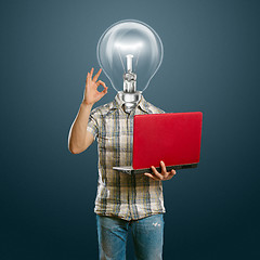 Image showing casual lamp-head with laptop shows OK