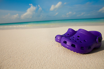 Image showing Kids shoes on the beach