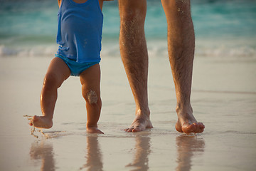 Image showing Father and kid's legs