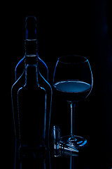 Image showing silhouette of bottles with glass of wine