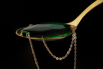 Image showing Golden spoon with coulomb