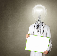 Image showing doctor with empty board and lamp-head