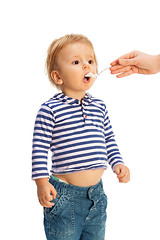 Image showing Cute toddler eat from spoon