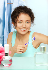 Image showing Laughing woman with toothbrush