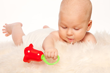 Image showing Baby playing with rattle