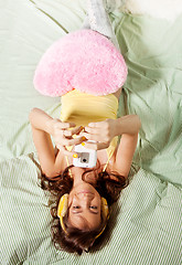 Image showing Happy teenage girl photographing with with phone