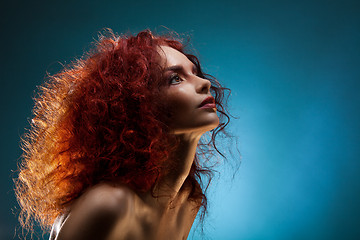 Image showing Portrait of a curly red hair woman