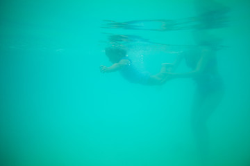 Image showing Teaching the kid to swim