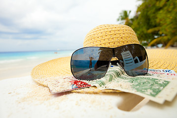 Image showing Straw hat, shades and money - all you need to relax on the beach