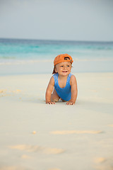 Image showing Happy kid crawling on the beach