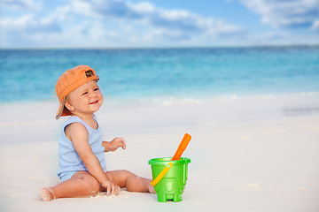 Image showing laughing kid playing with scoop