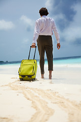 Image showing White-collar worker and beach vacation