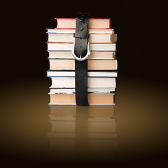 Image showing books pile with belt