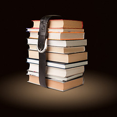 Image showing books pile with belt