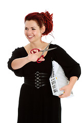 Image showing  Modern girl with scissors and folder of documents