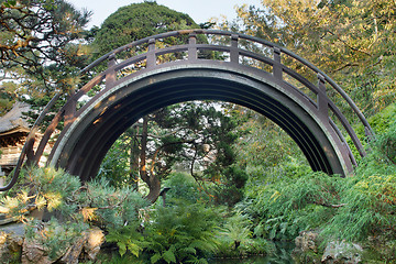 Image showing Curved Wooden Bridge at Japanese Garden