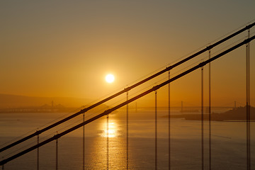 Image showing Sunrise over Golden Gate and Oakland Bay Bridge