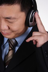 Image showing Asian businessman listening