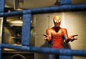 Image showing Spiderman. Hero helping people in trouble.