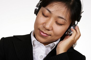 Image showing Asian businesswoman listening