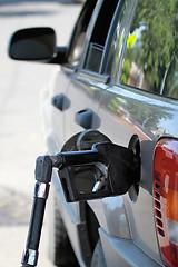 Image showing Pump Filling Up the Car Gas Tank