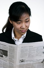 Image showing Asian businesswoman reading