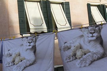 Image showing Two sheets printed drying outdoors