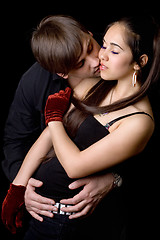 Image showing Man kissing woman