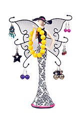 Image showing statuette woman with wings hung with jeweled