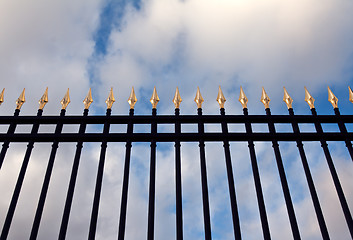 Image showing steel fence with gold spears